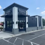 Exterior of Canal Coffee Co. building with drive-thru lane and storefront signage.