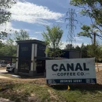 Canal Coffee Co. building with a Brewing Soon sign in front.