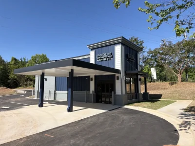 Canal Coffee Co. drive-thru location exterior on a sunny day.