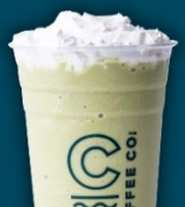 Green blended drink with whipped cream in a Canal Coffee Co. cup
